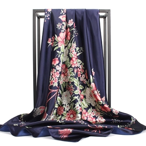 90cm Navy blue silk scarf with pink floral print on a black minimalist metal stand