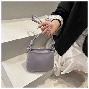 Lavender purple shoulder bag with knotted handle detail and printed brand logo
