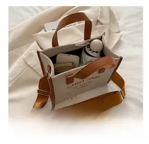 Detailed top view of a canvas tote bag showing its large capacity with daily essentials
