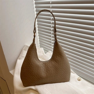 Chic brown woven hobo bag with a minimalist half-moon silhouette and zipper closure