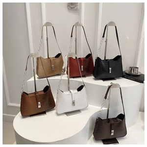 Detailed display of crocodile embossed leather shoulder bags in six vibrant trendy colors