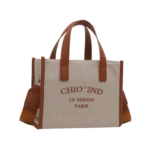 Retro canvas tote bag in beige and brown with adjustable shoulder strap and leather handles