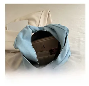 Internal view of the light blue denim tote bag showing its large storage capacity