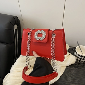 Red leather shoulder bag with a silver rhinestone buckle and elegant chain strap