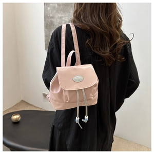 Pink PU leather mini drawstring backpack with silver fashion plate and bead detail