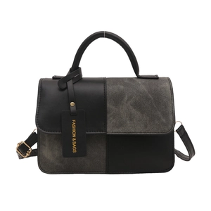 Chic two-tone black leather and grey fabric crossbody bag with golden metal hardware