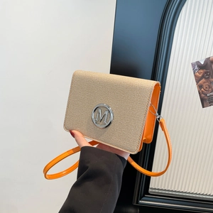 Retro contrast crossbody bag with straw flap, orange leather and silver M buckle