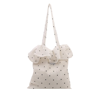 Borsa tote bianca con fiori, bordo a volant e etichetta Magic Pocket centrale