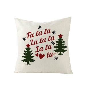 Détail de la housse de coussin de Noël en lin avec texte Fa la la et motifs festifs