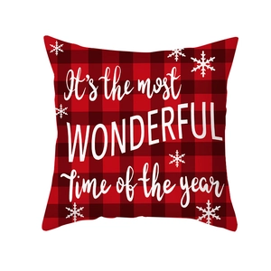 Christmas Buffalo plaid pillow cover with white festive text and snowflakes