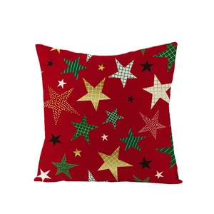 Détail de la housse de coussin rouge en lin avec motifs d'étoiles de Noël variés