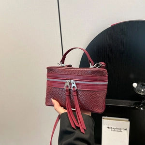 Vintage burgundy woven box bag with silver zippers and long leather tassels