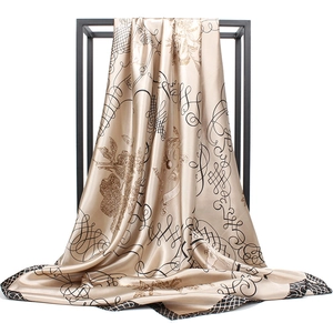 Elegant champagne gold satin scarf with musical notes on a minimalist metal stand