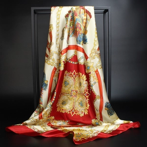 Macro detail of royal carriage chain print on 90cm satin silk square scarf with red border