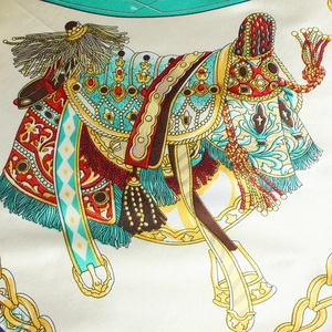 Macro detail of carriage and harness print on elegant 90cm silk scarf fabric