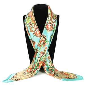 Detail of 90x90cm satin square scarf with paisley floral print on a display mannequin