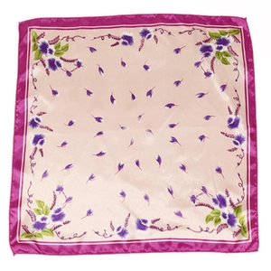 Detailed pattern of floral satin scarf with pink center and vibrant rose red borders