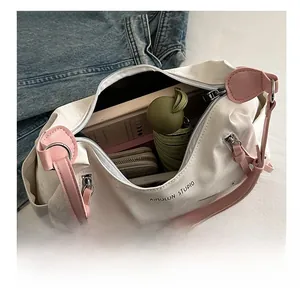 Top view of white canvas tote bag showing interior storage for umbrella and wallet