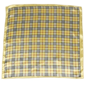 Detail of British style check pattern satin square scarf with beige base and satin borders