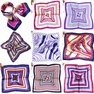 Detailed grid of nine printed satin square scarves featuring diverse artistic patterns