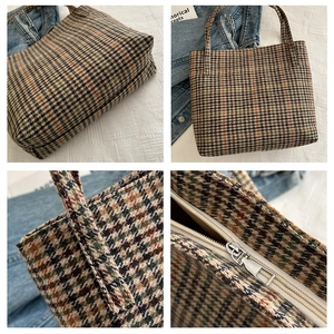 Detail view of houndstooth tote bag featuring premium tweed texture and metal zipper closure