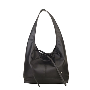 Large black oil wax leather tote bag with a bow accent and a small silver heart detail