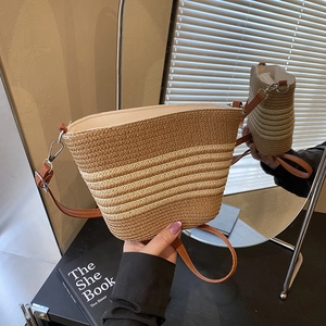 Retro striped straw bucket bag with brown synthetic leather strap for beach and casual use