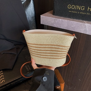 Retro striped straw bucket bag with brown leather strap for beach and casual summer wear