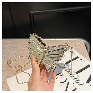 Exquisite gold butterfly clutch bag with white crystals and thin metal chain strap