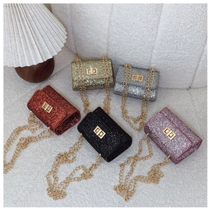 Detailed view of mini sequin chain bags in five glittery colors with metal clasps