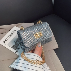 Sparkly silver rhinestone mini flap bag with gold chain and metal twist lock detail