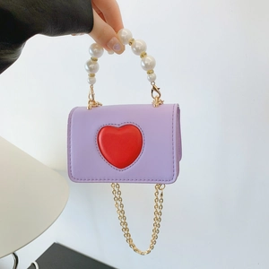Mini heart crossbody bag in purple faux leather with pearl handle and golden chain