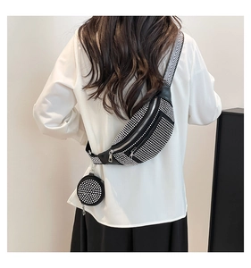 Detail of black rhinestone crossbody saddle bag with geometric wide strap and mini pouch