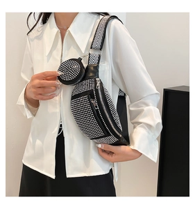 Detail of black rhinestone crossbody bag with woven strap and detachable coin purse