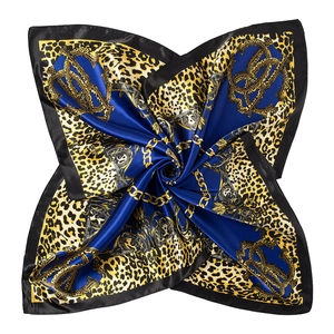 Detail of satin leopard print scarf with golden chains and blue baroque patterns
