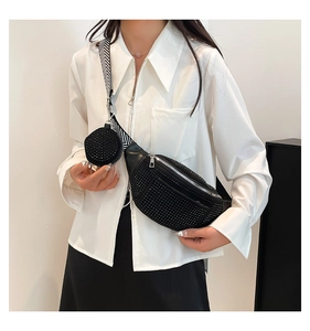 Detail of black crossbody bag with rhinestone finish and patterned wide shoulder strap