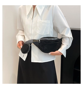Detail of black rhinestone waist bag with mini round pouch and geometric pattern strap