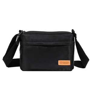 Classic black nylon crossbody bag with adjustable strap and front leather logo detail