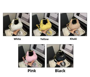 Detail of trendy mini PU crossbody bags with gold metal handles in five chic colors