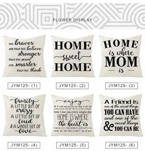 Detail view of polyester pillow covers featuring black letters on off-white fabric
