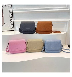 Minimalist crossbody bags with woven texture in five trendy colors on a white display
