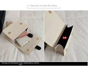 Detail view of the white croc-embossed bag interior showing spacious main compartment