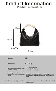 Detail of elegant black PU saddle bag with decorative pearl handle and metal chain strap