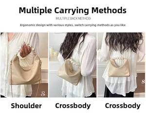 Three-way carry style of a beige dumpling bag with pearl handle and chain strap