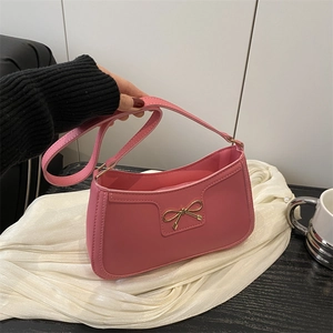 Pink crescent underarm bag with gold bow knot and zipper closure for women
