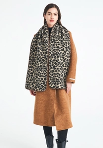 Close-up of thick leopard print scarf with detailed stitched edges and soft texture