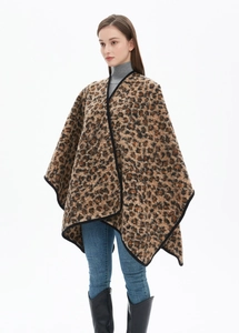 Close-up of leopard print shawl with thick knit texture and black border detail