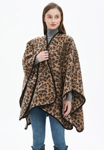 Detailed view of leopard print shawl with reinforced edges and premium drape quality