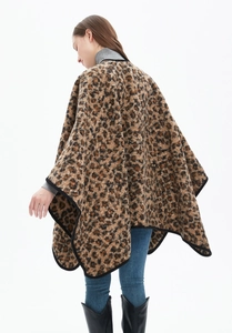Detail of leopard print shawl showing the back silhouette and draped knit texture