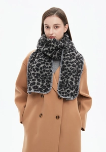 Close-up of black and grey leopard print winter scarf with grey stitched edges